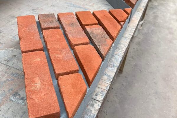 BRICK TUMBLING TO GABLE